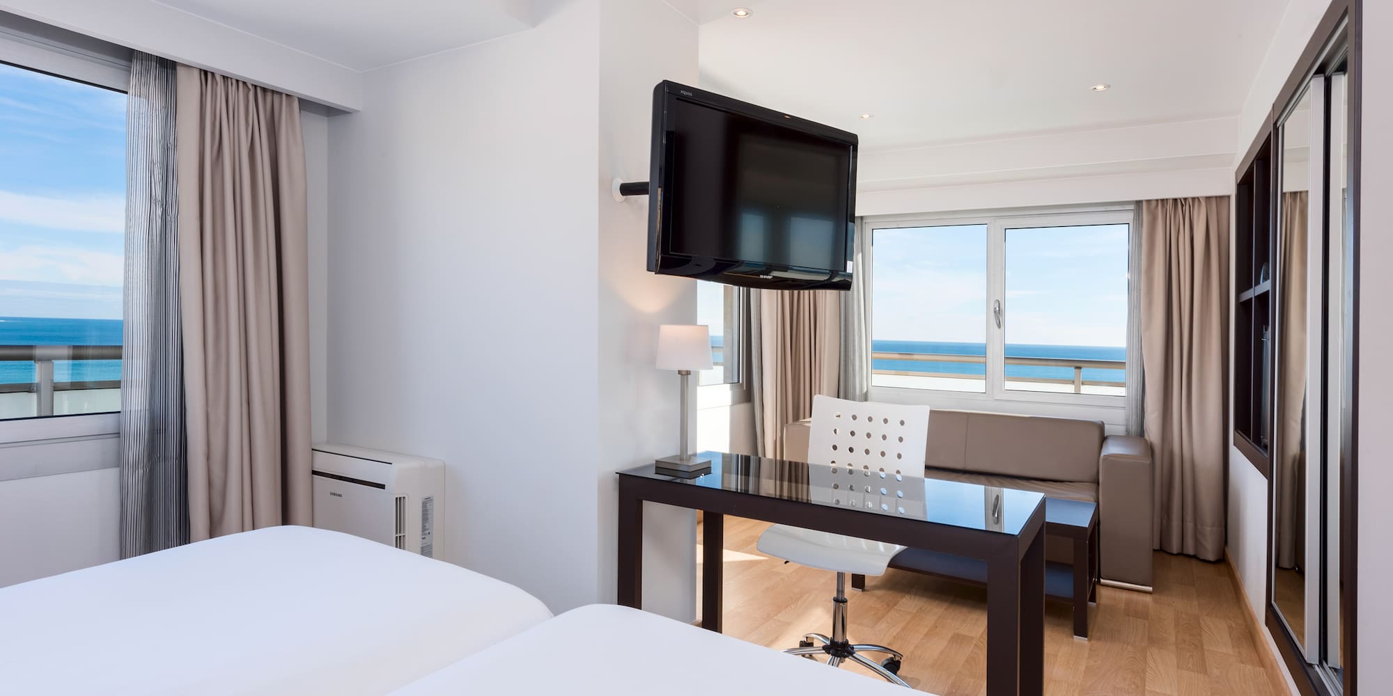 a room with a television mounted on the wall