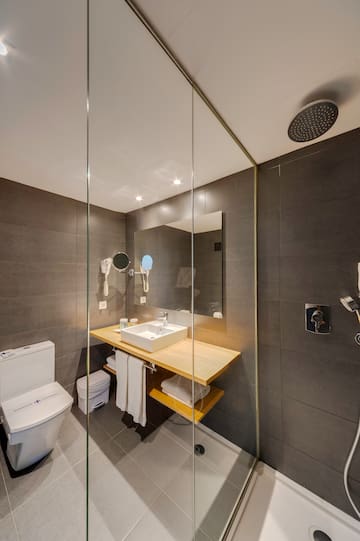 a bathroom with a shower and sink