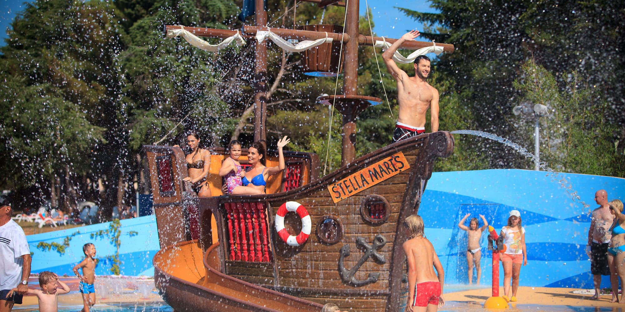a group of people on a ship in a pool