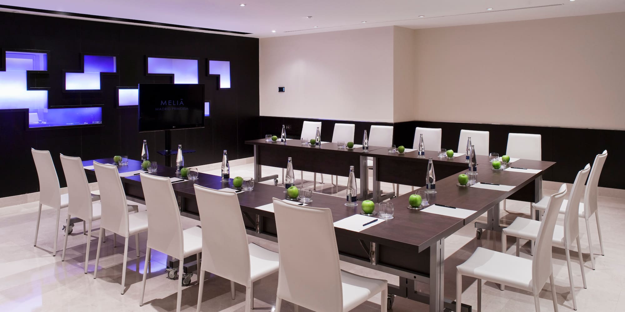 a room with a table and chairs