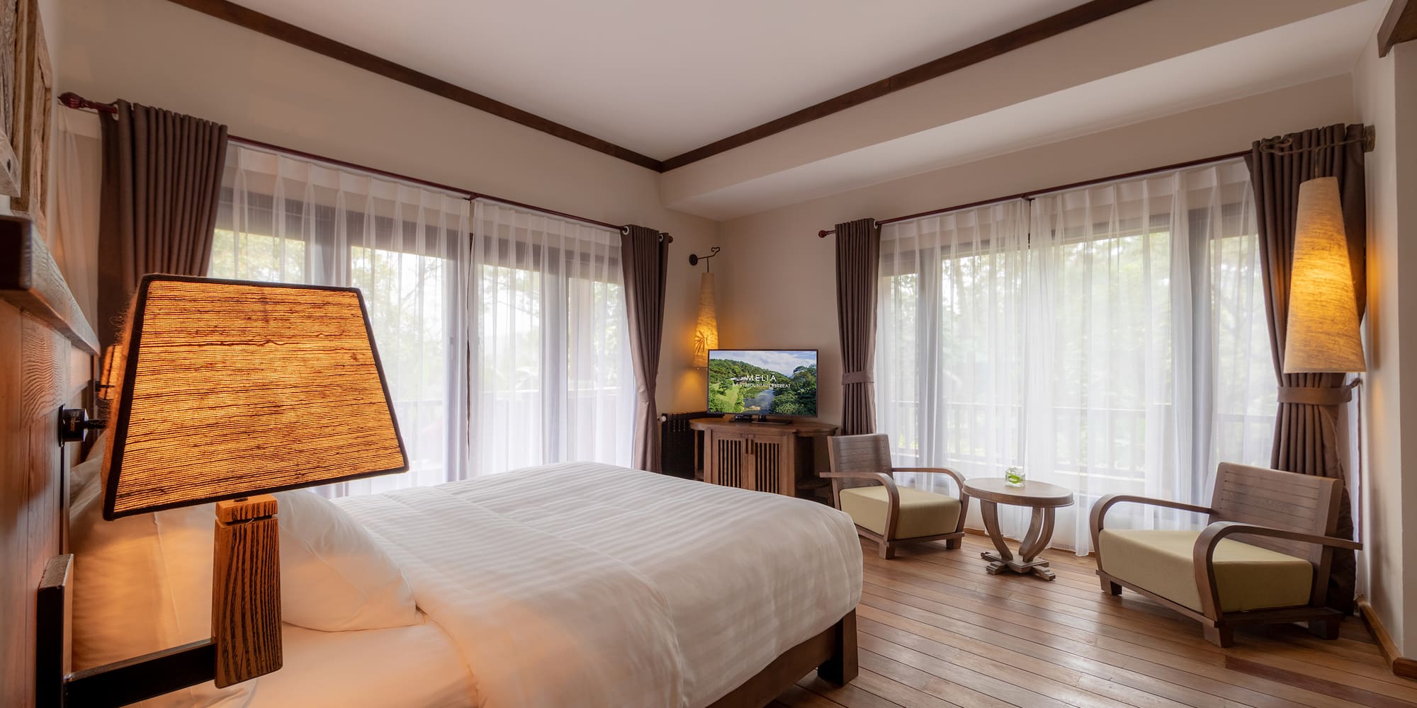 a bedroom with a television and a bed