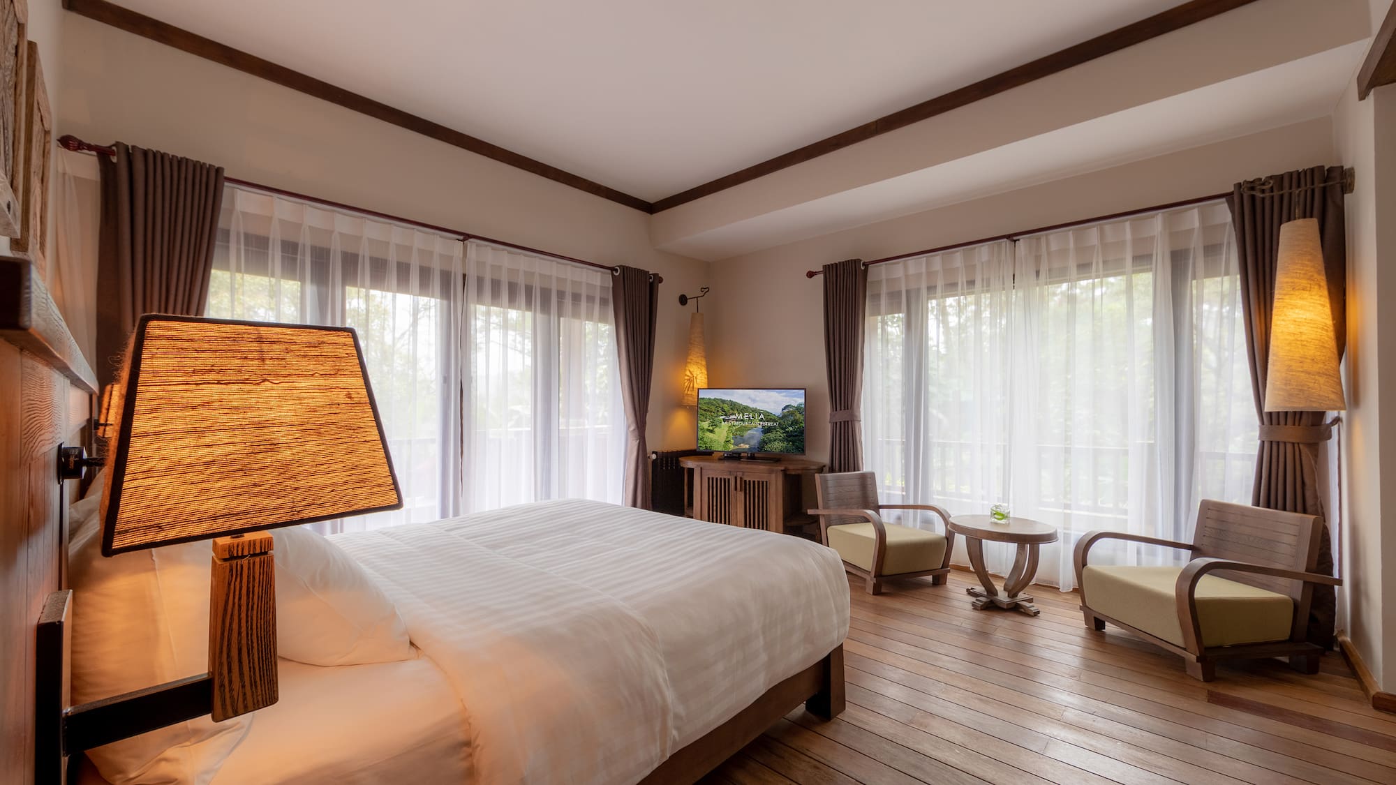 a bedroom with a television and a bed