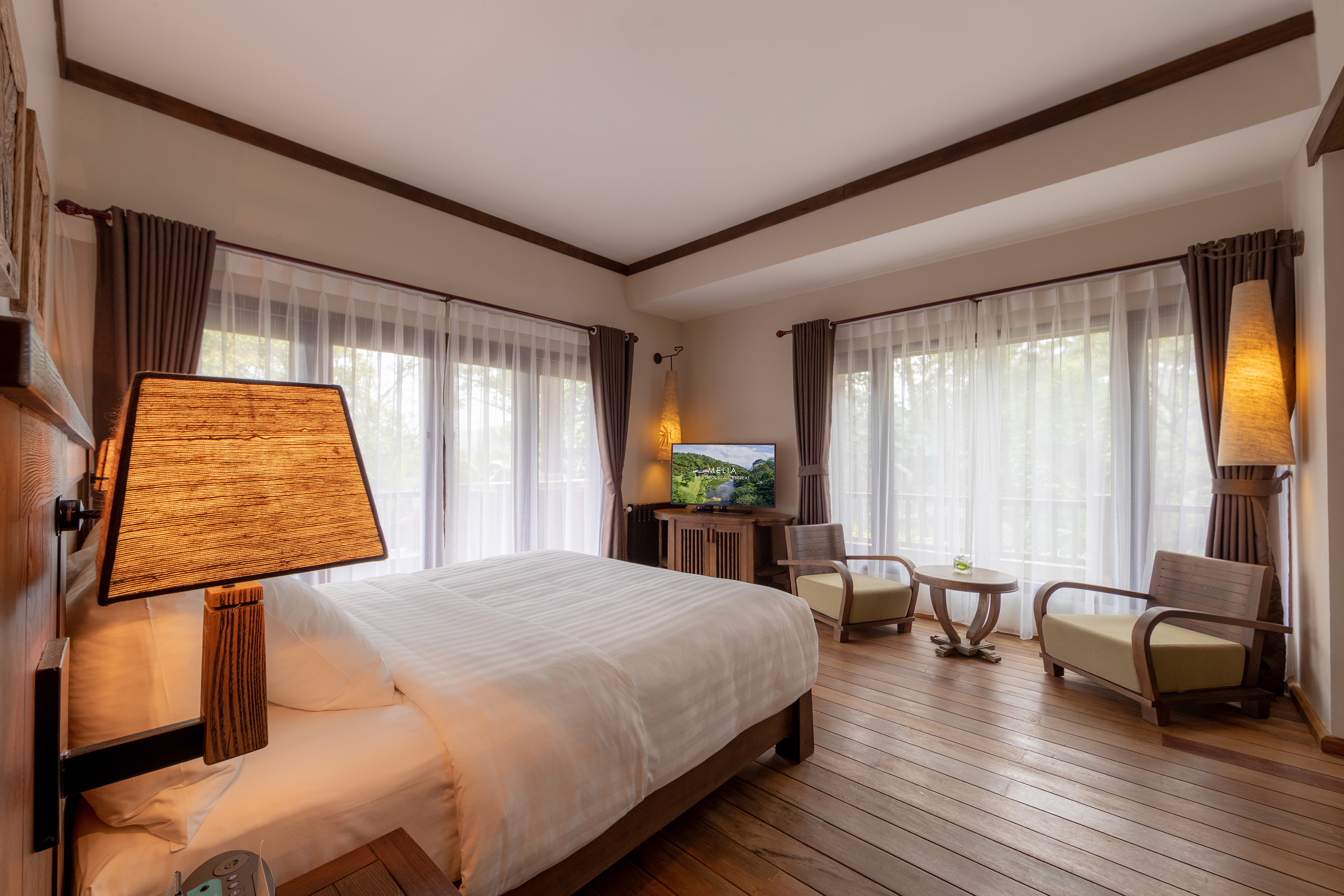 a bedroom with a television and a bed