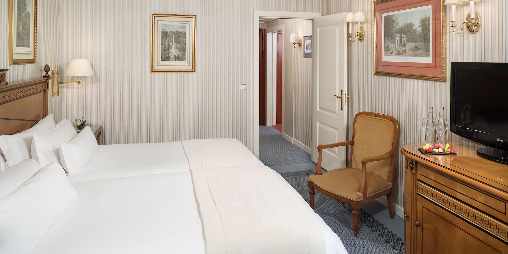 a bedroom with a bed and a chair