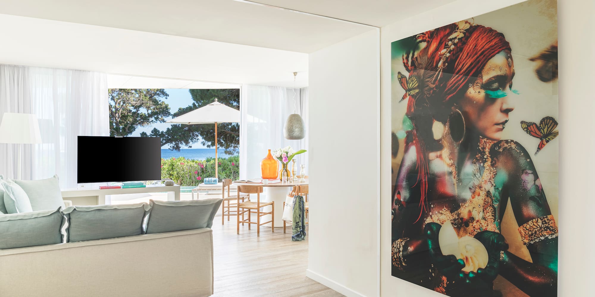 a living room with a large painting on the wall