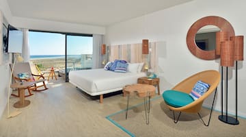 a room with a bed and a chair