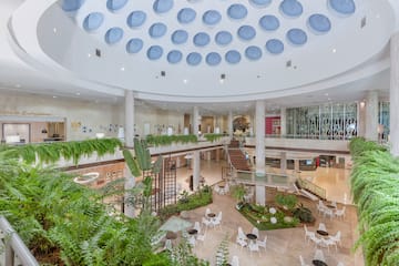 a large building with a large atrium and plants