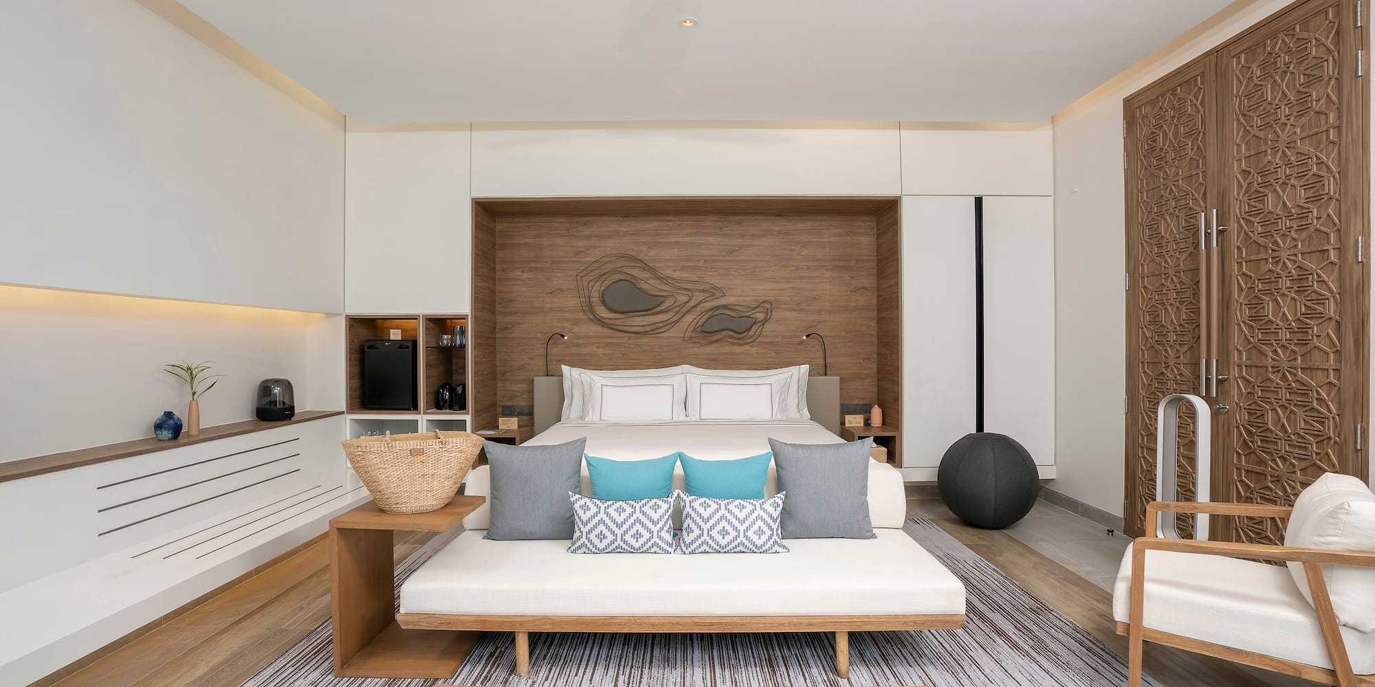 a room with a bed and a fan