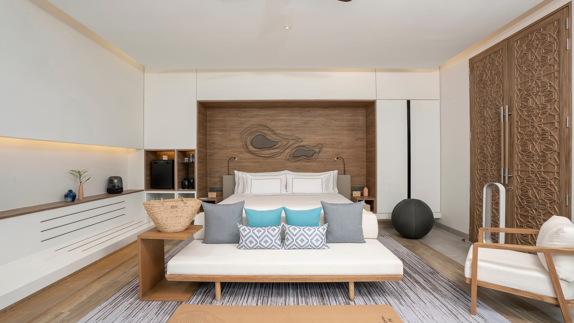 a room with a bed and a fan