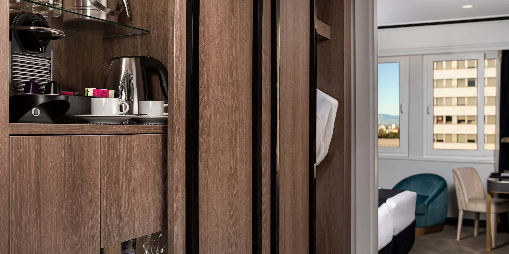 a room with a shelf and a coffee pot