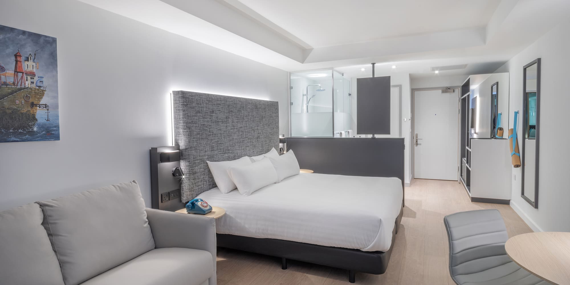 a room with a bed and a chair