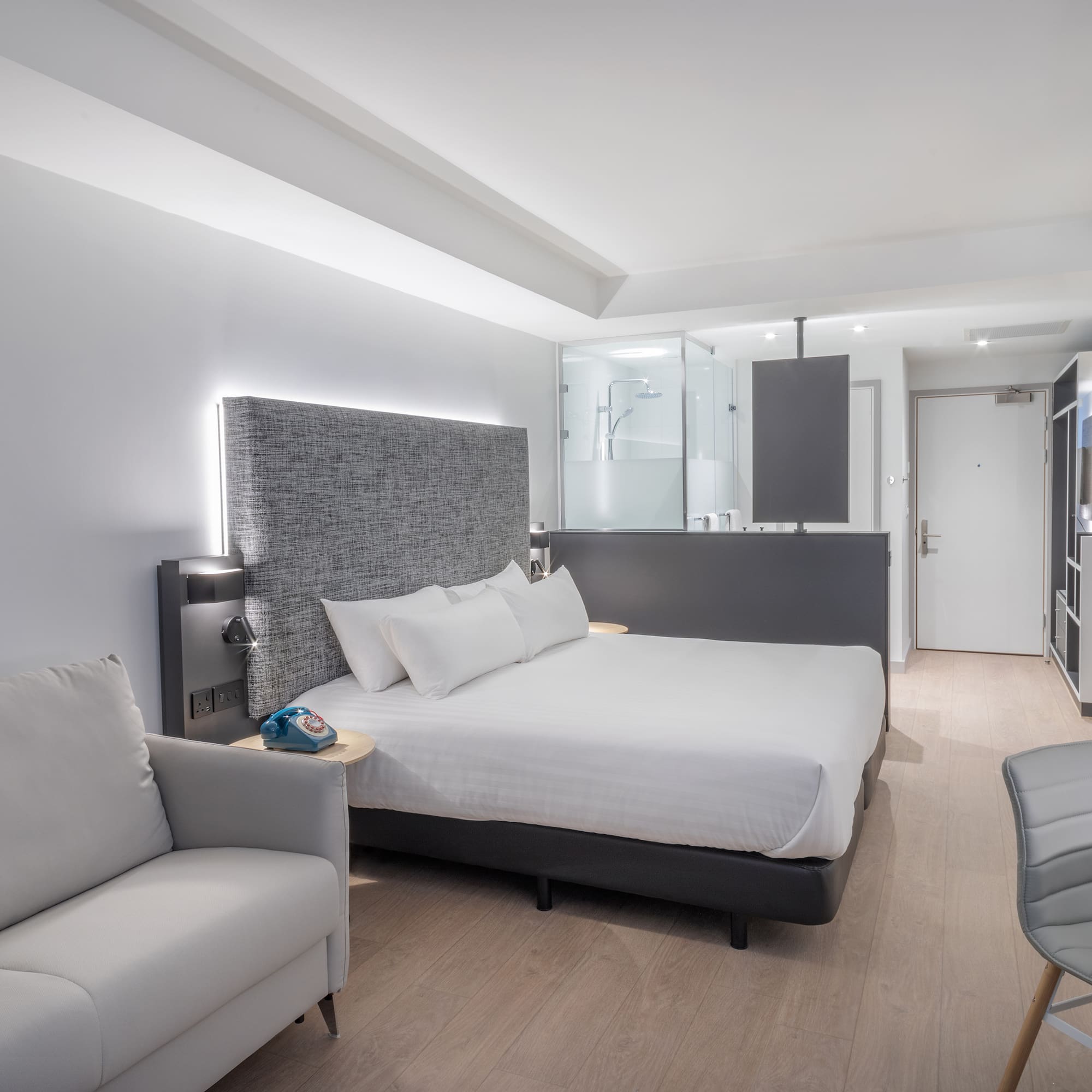 a room with a bed and a chair