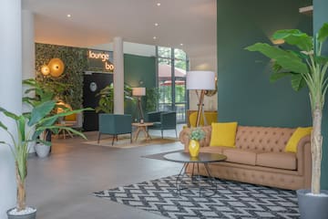 a lounge area with a couch and a table