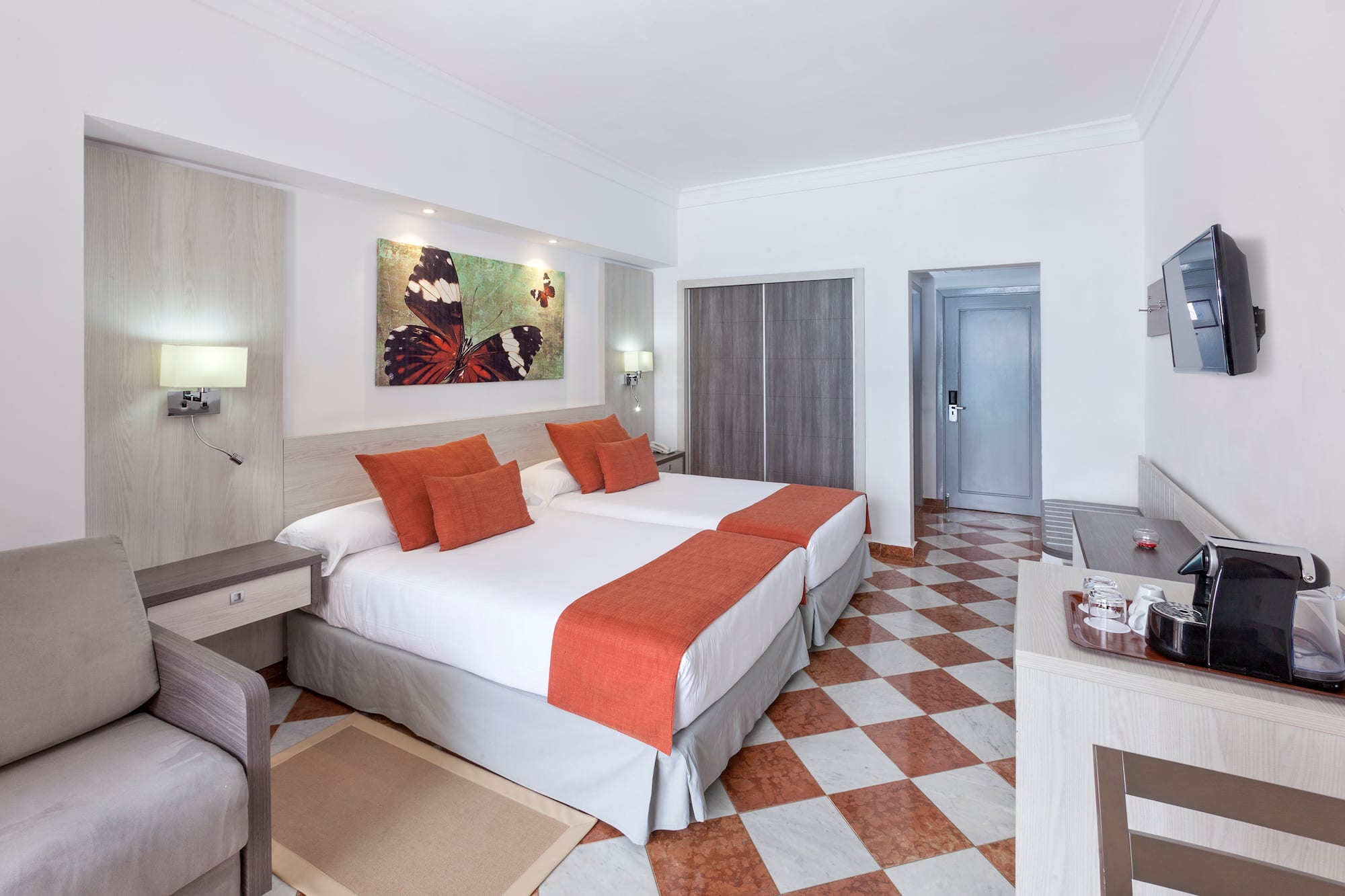 a room with a bed and a chair