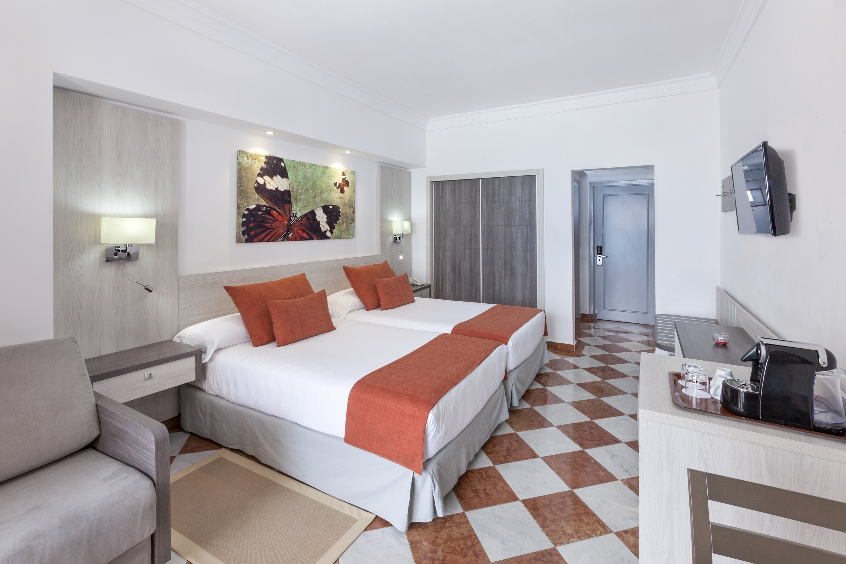 a room with a bed and a chair