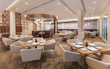 a restaurant with tables and chairs