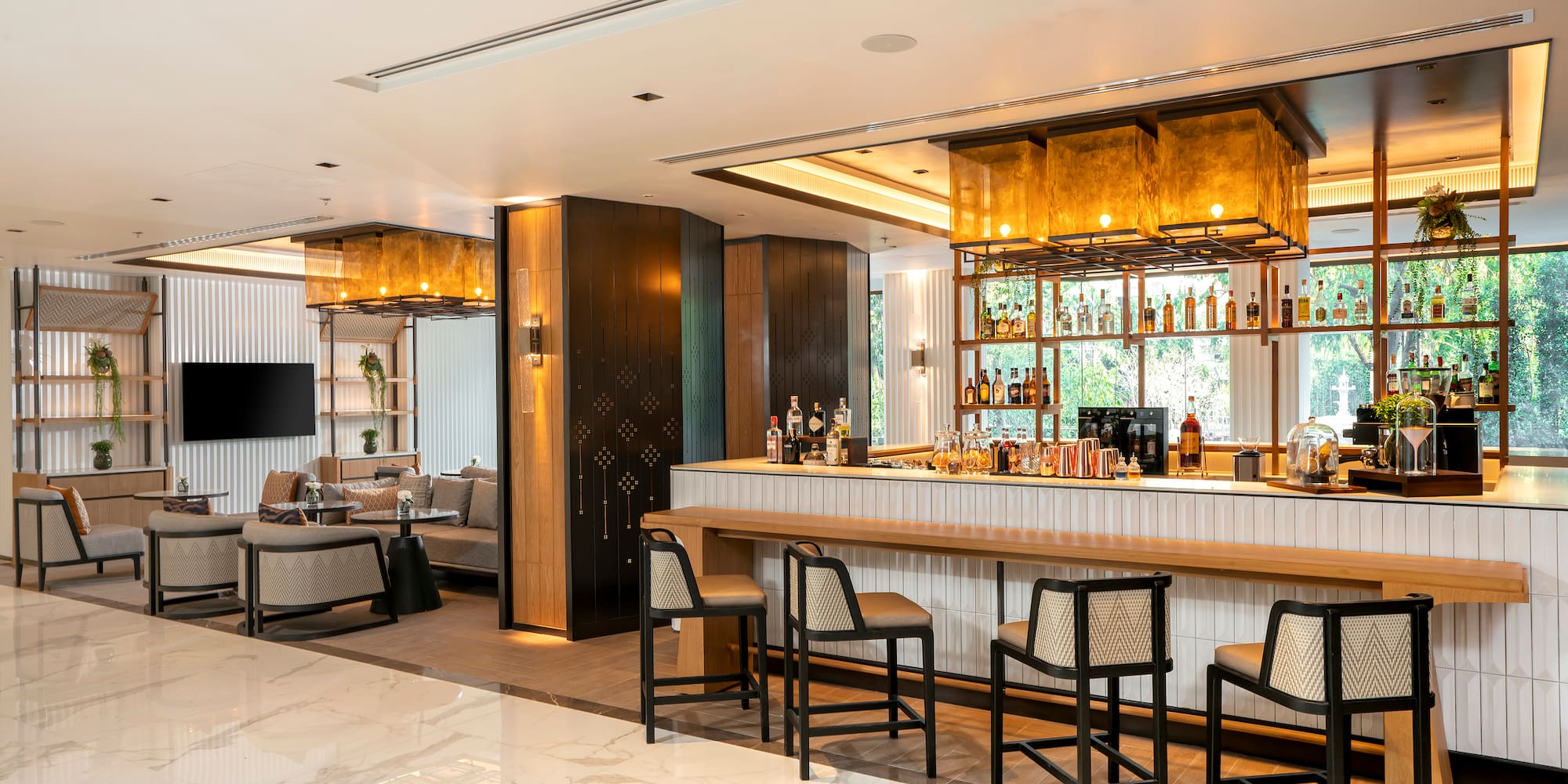 a bar with chairs and a tv