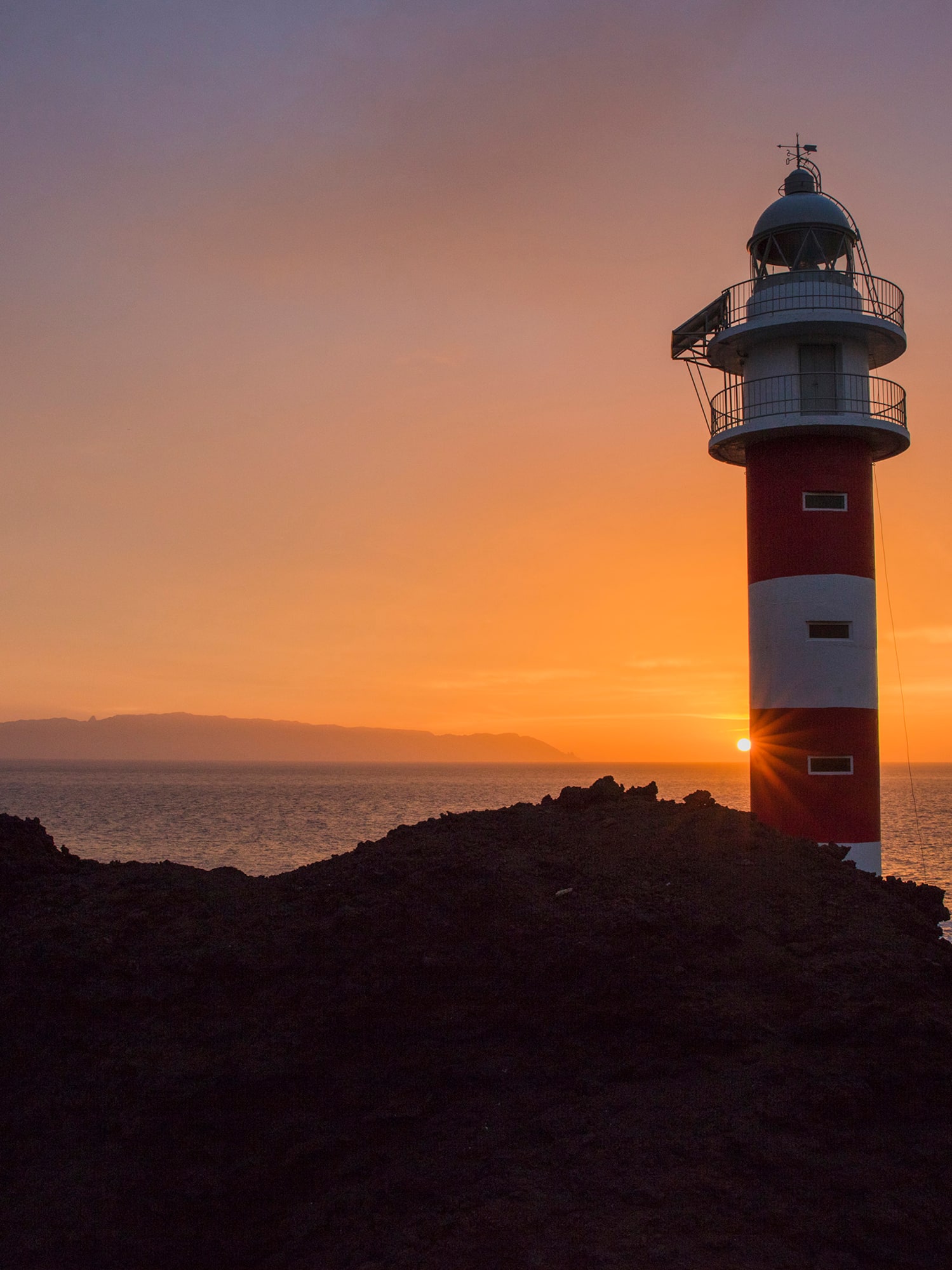 a lighthouse on a rocky shore