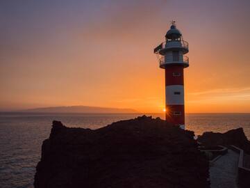 a lighthouse on a rocky shore