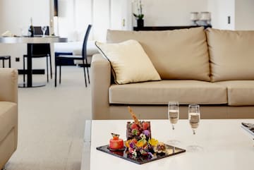 a table with food on it and two glasses of champagne