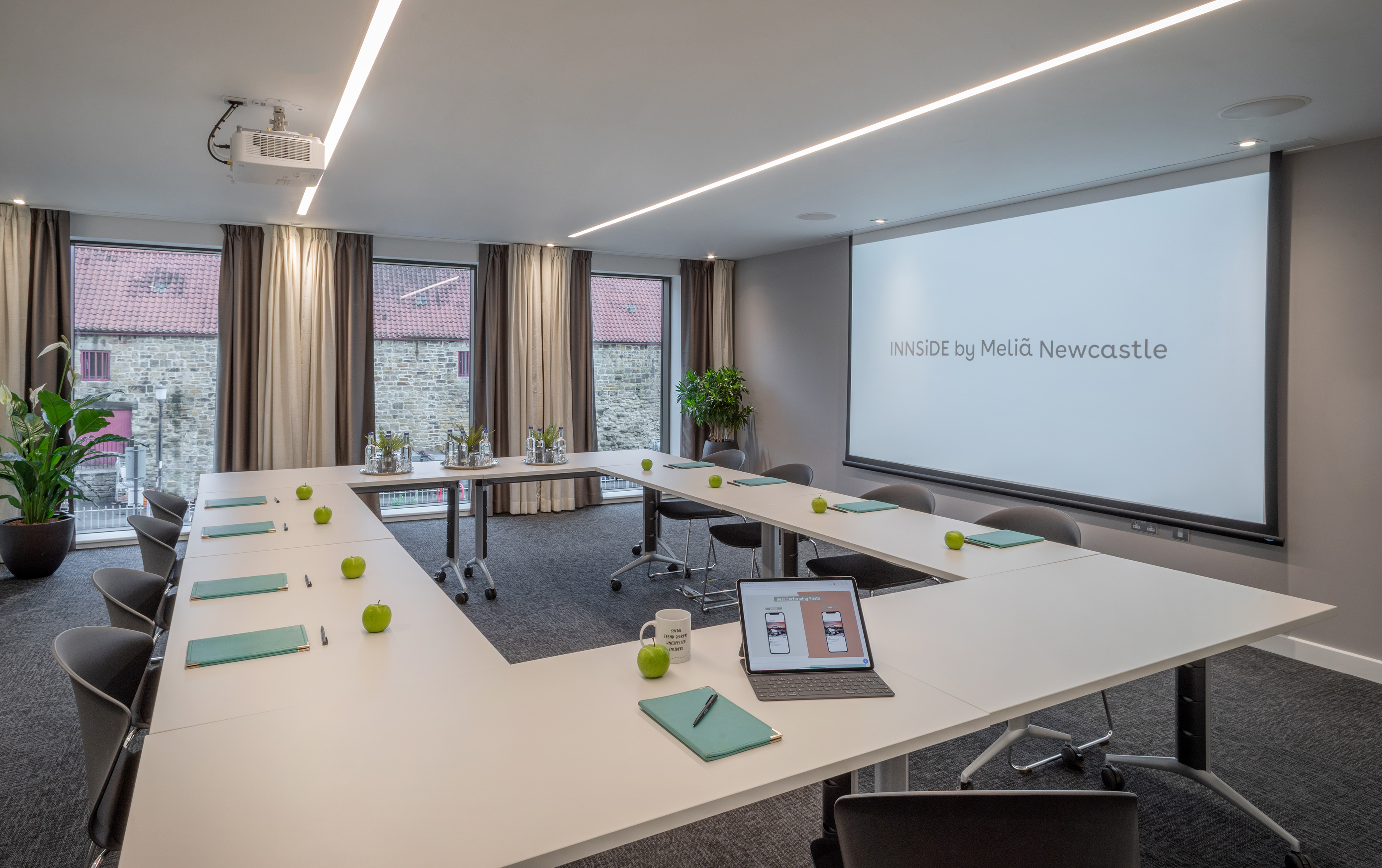 Modern U-shape conference room with projector screen, INNSiDE Newcastle.
