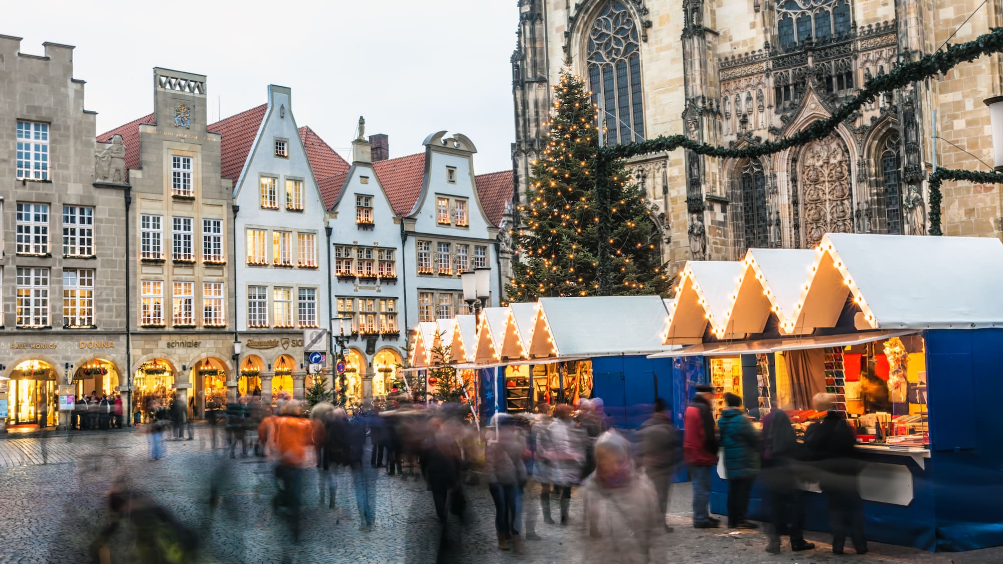 a group of people walking in a city