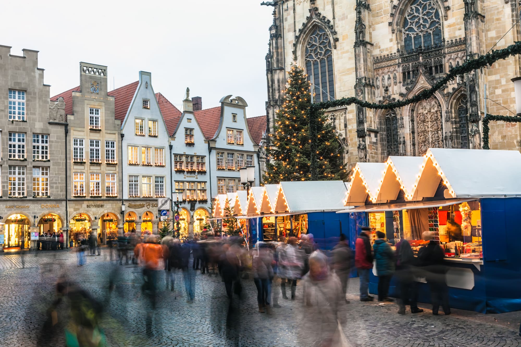 a group of people walking in a city