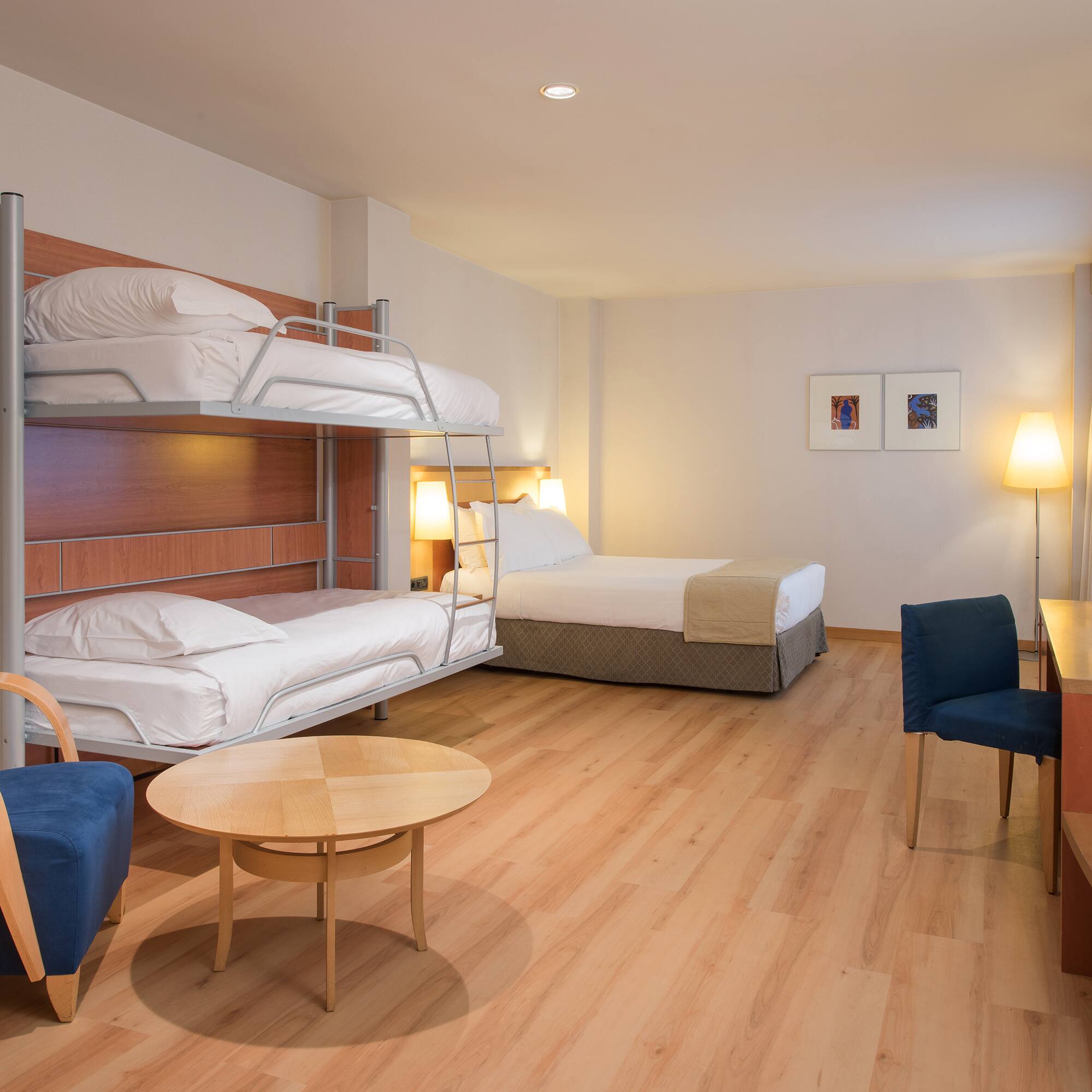 a room with bunk beds and a table