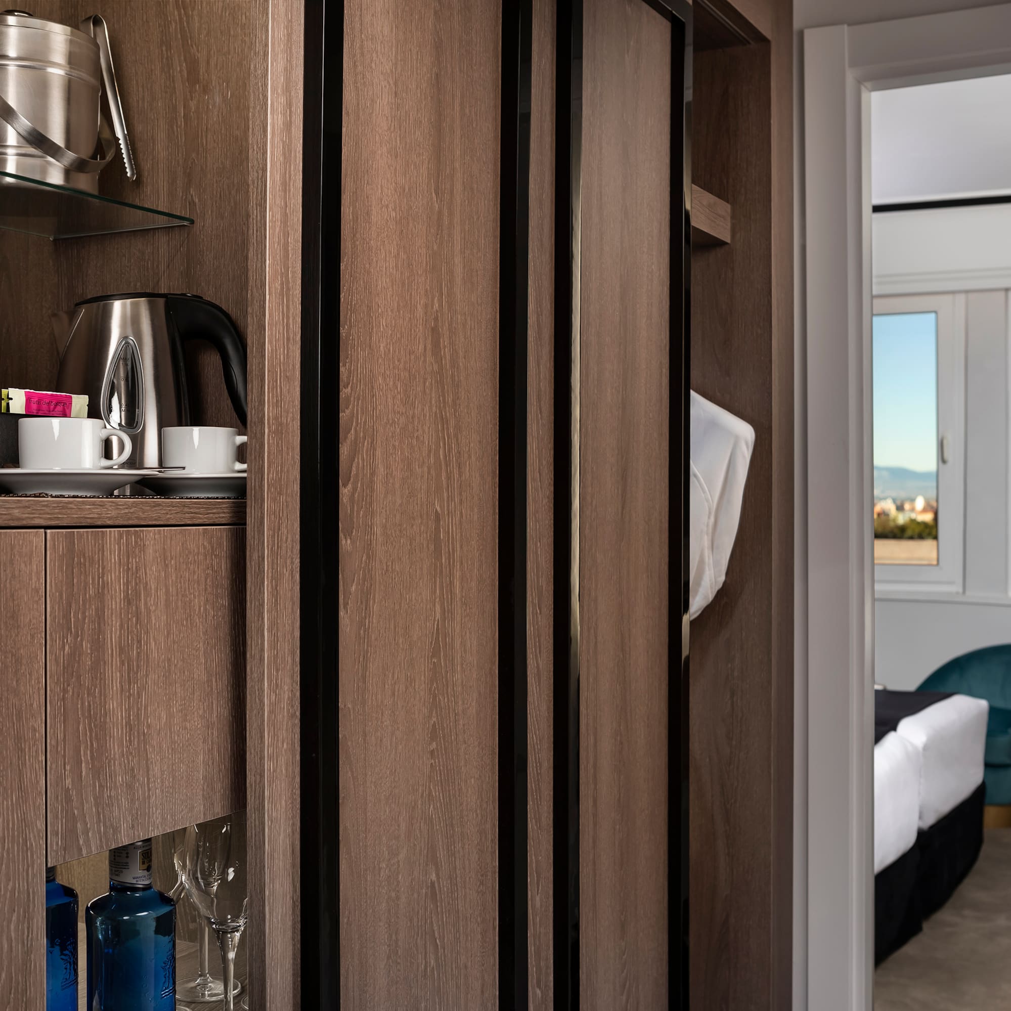 a room with a shelf and a coffee pot