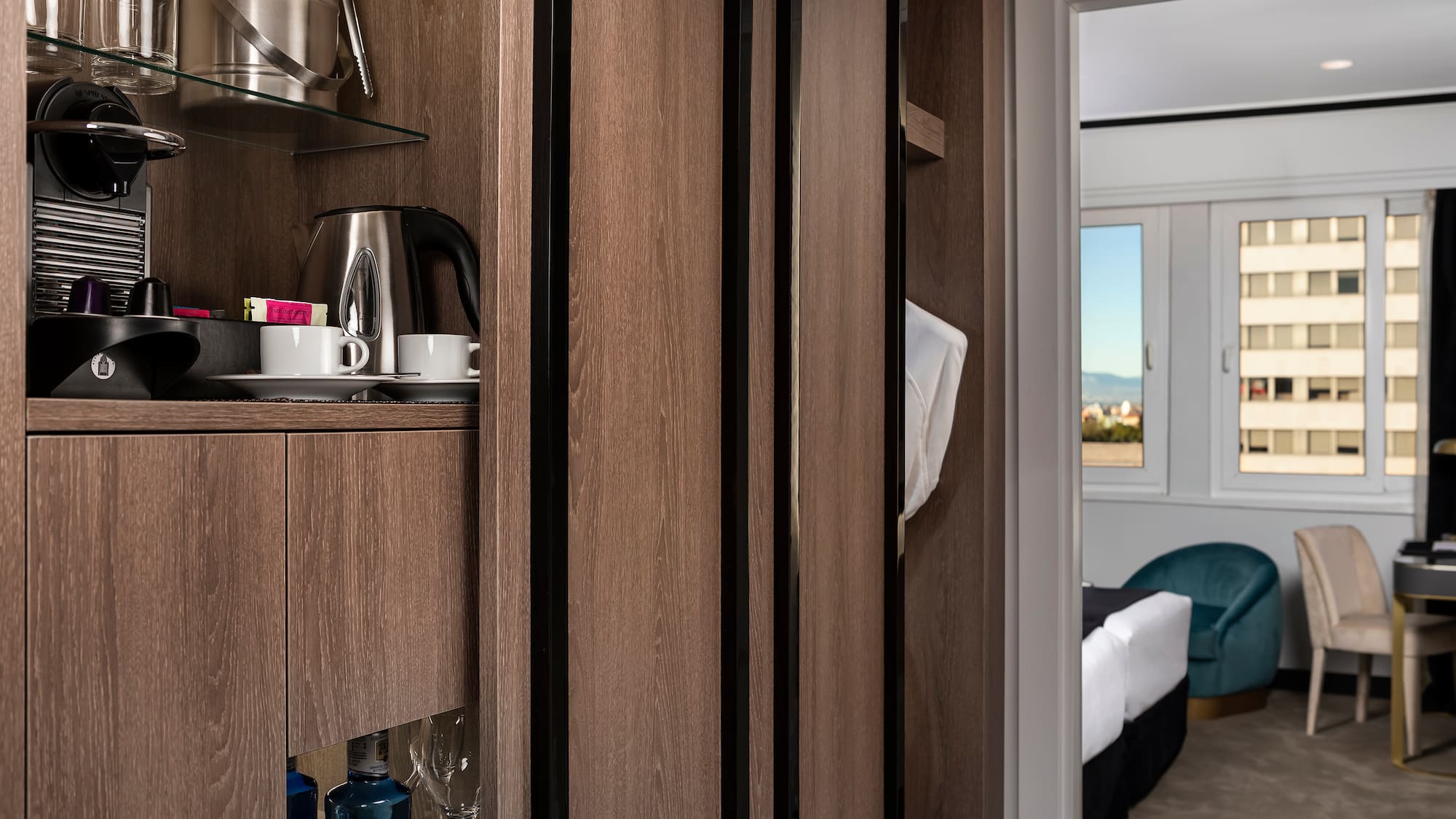 a room with a shelf and a coffee pot