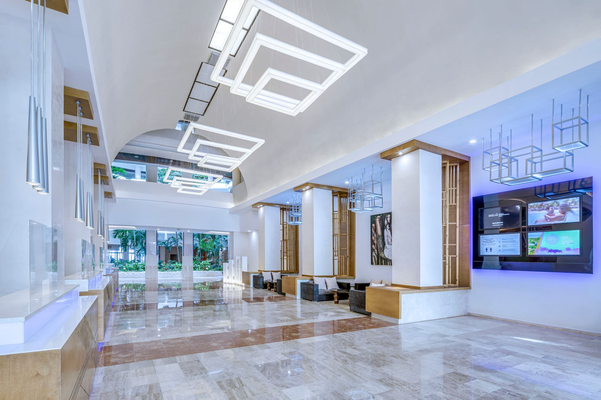 a large hall with a television and a large wall