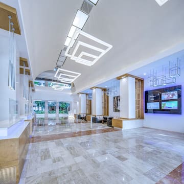a large hall with a television and a large wall