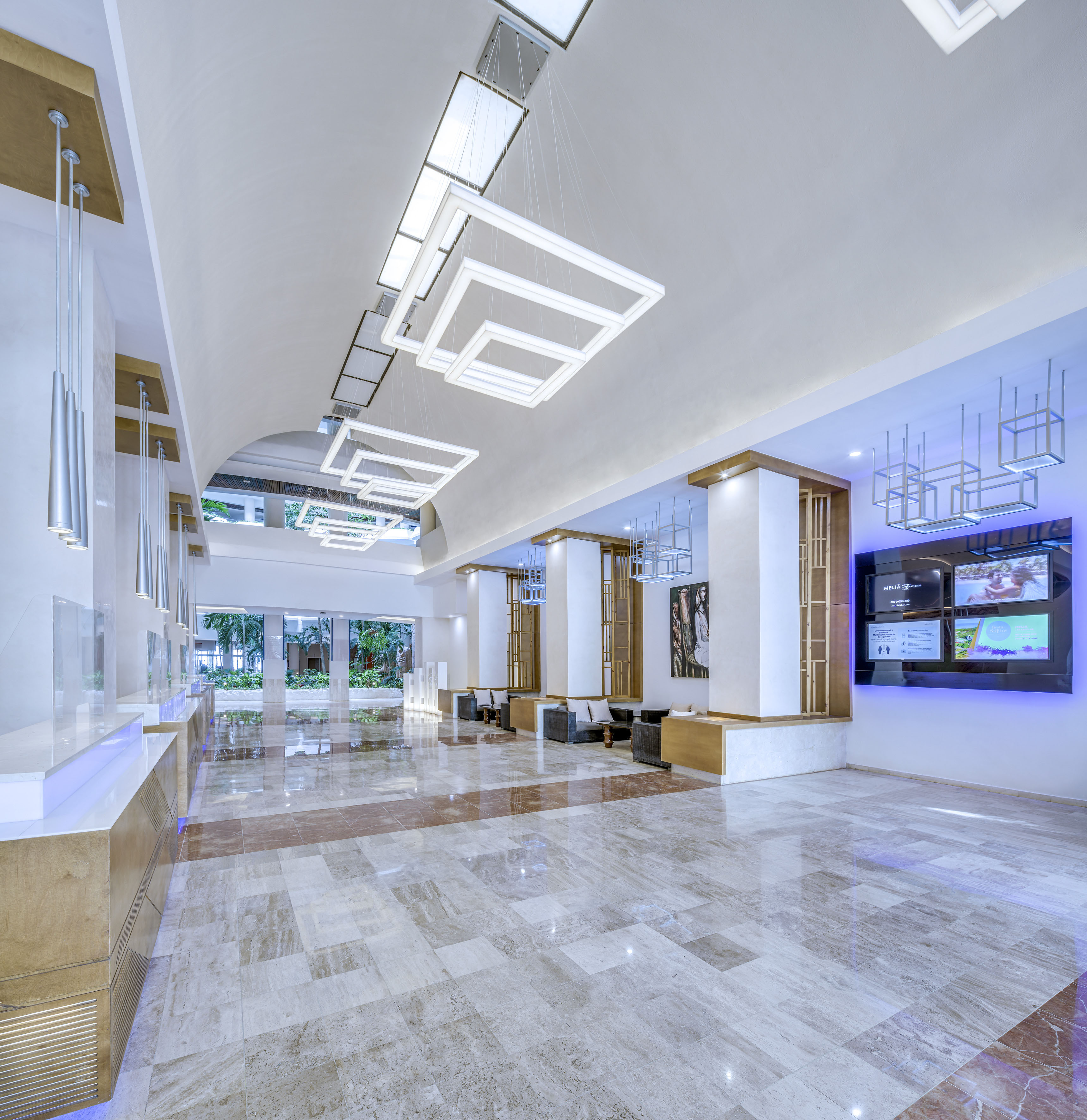 a large hall with a television and a large wall