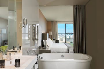 a bathroom with a bathtub and a window