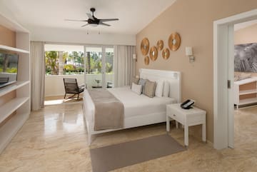 a bedroom with a bed and a ceiling fan