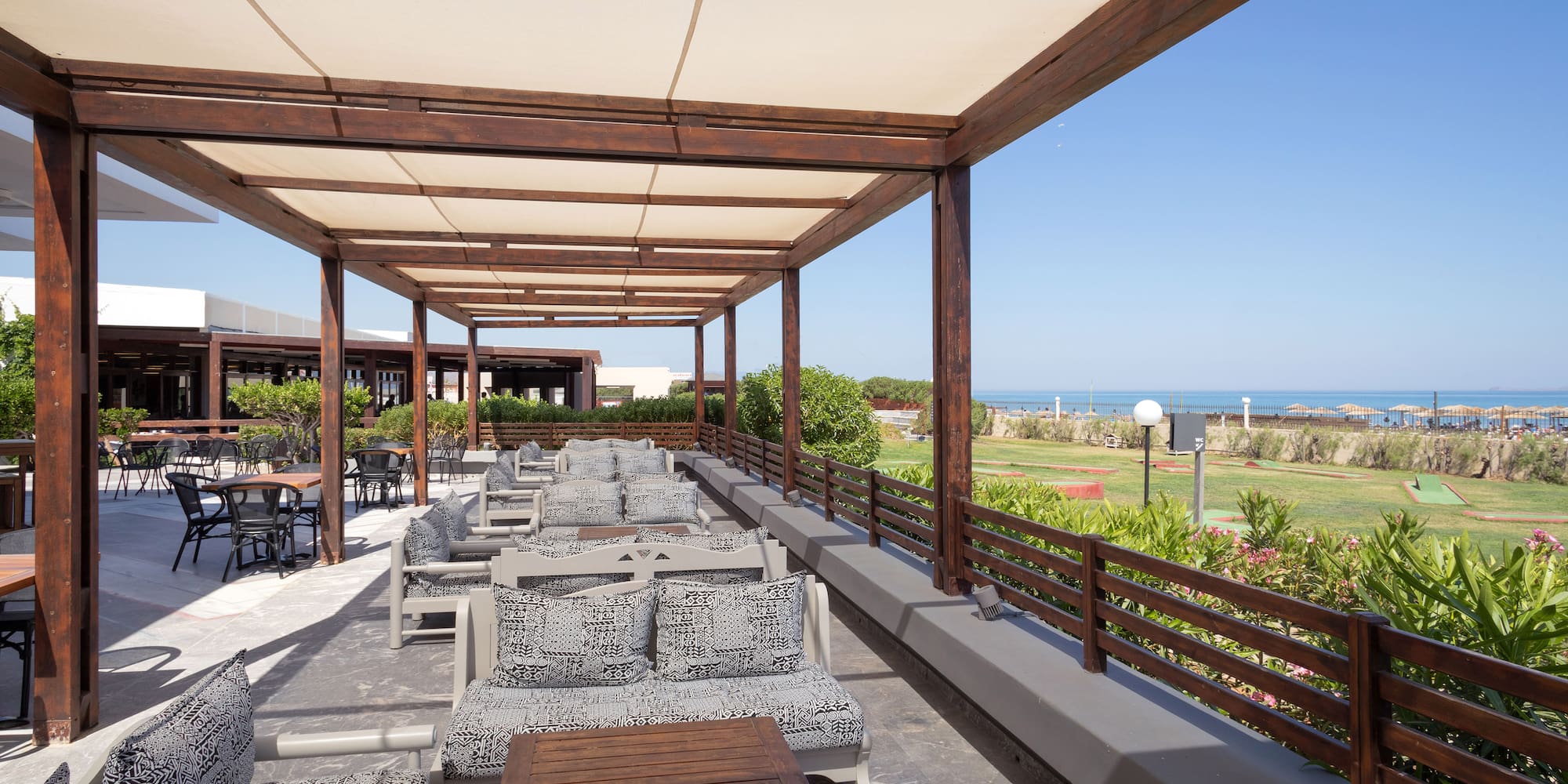 a patio with chairs and tables