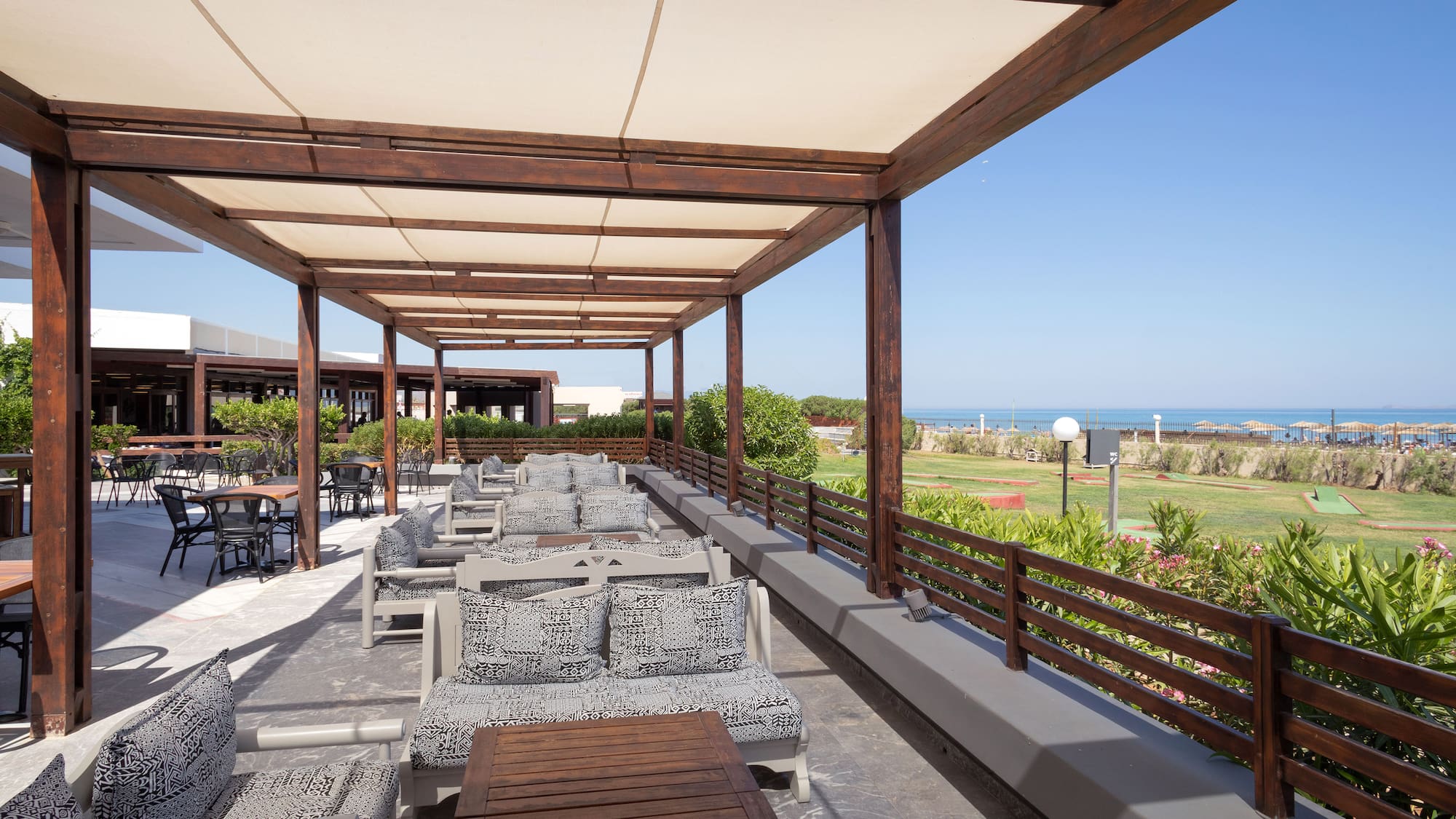 a patio with chairs and tables