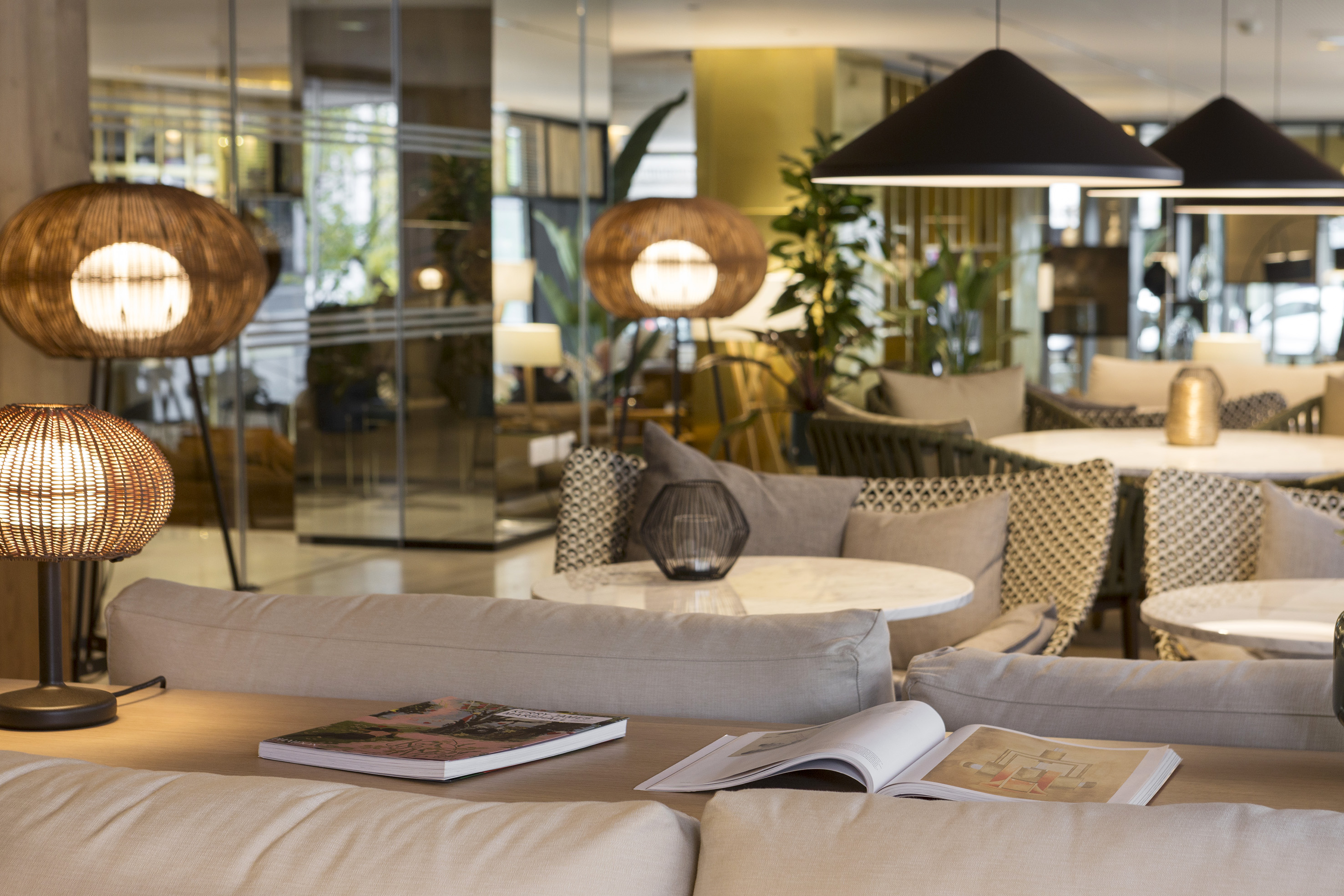 a room with a couch and chairs