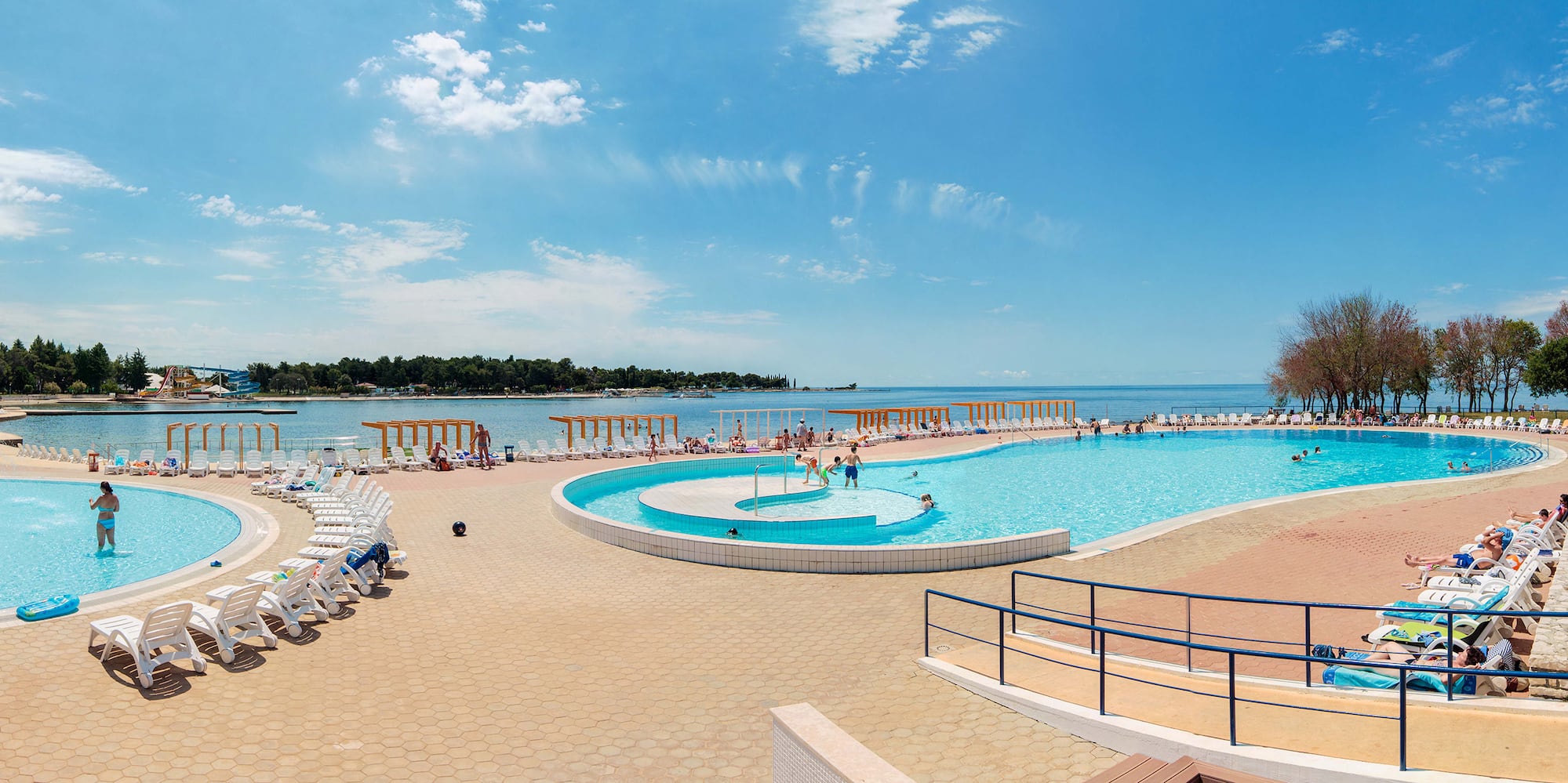 a pool with people swimming in it
