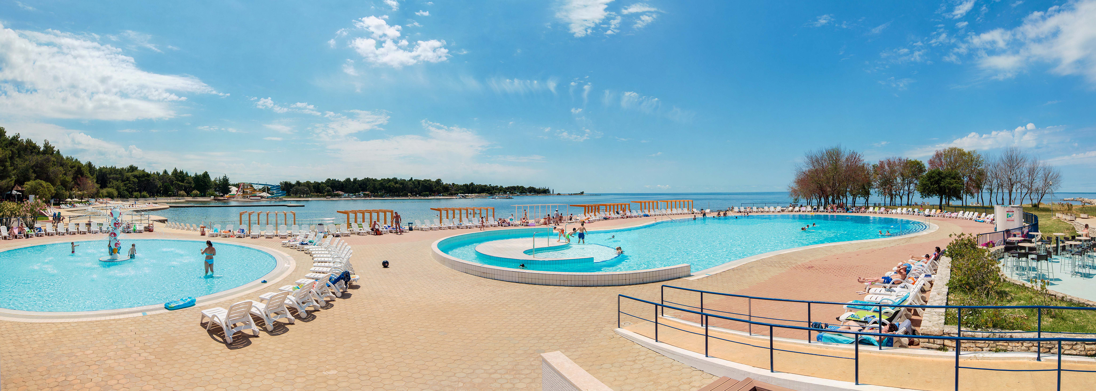 a pool with people swimming in it