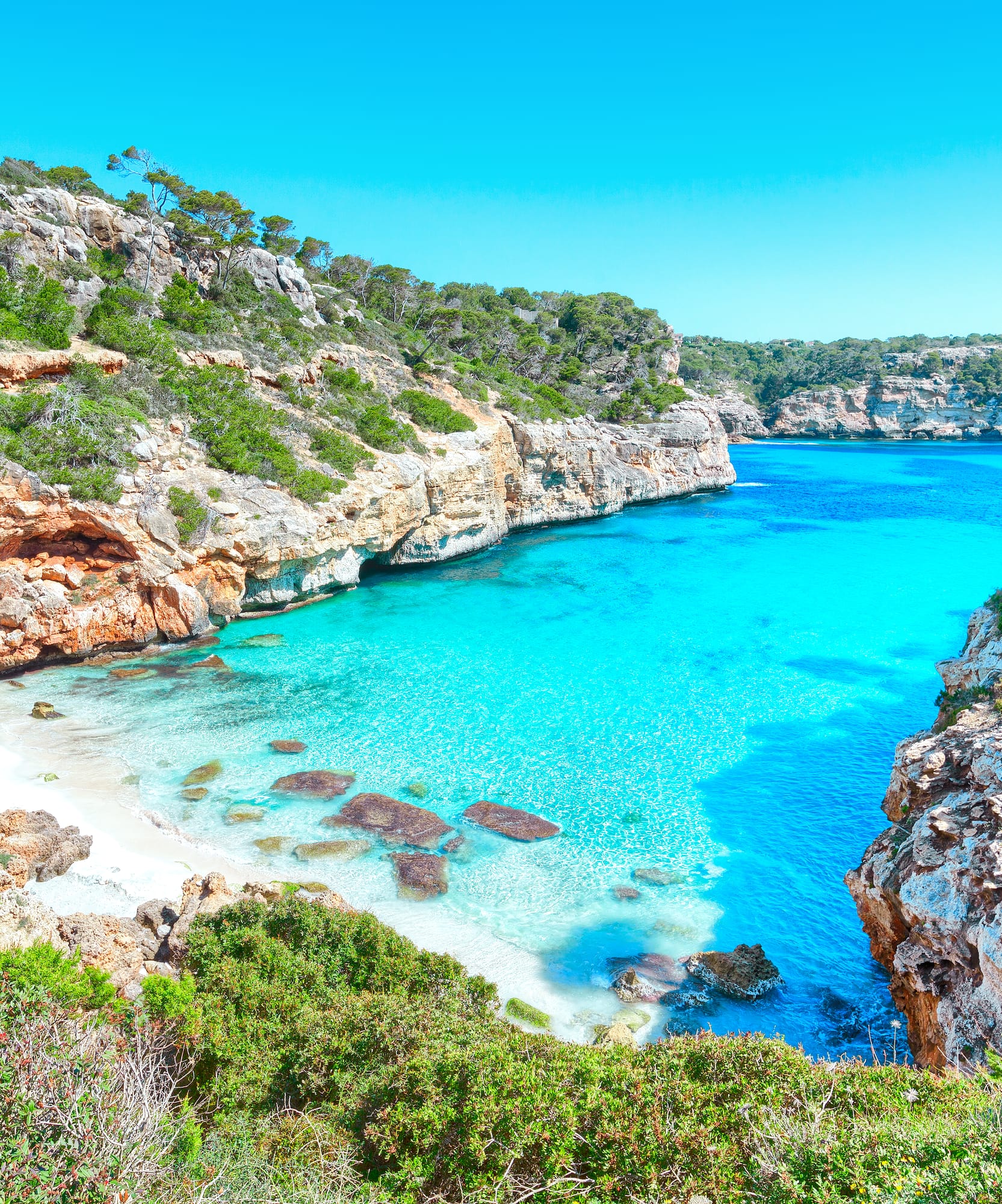 a blue water and rocks