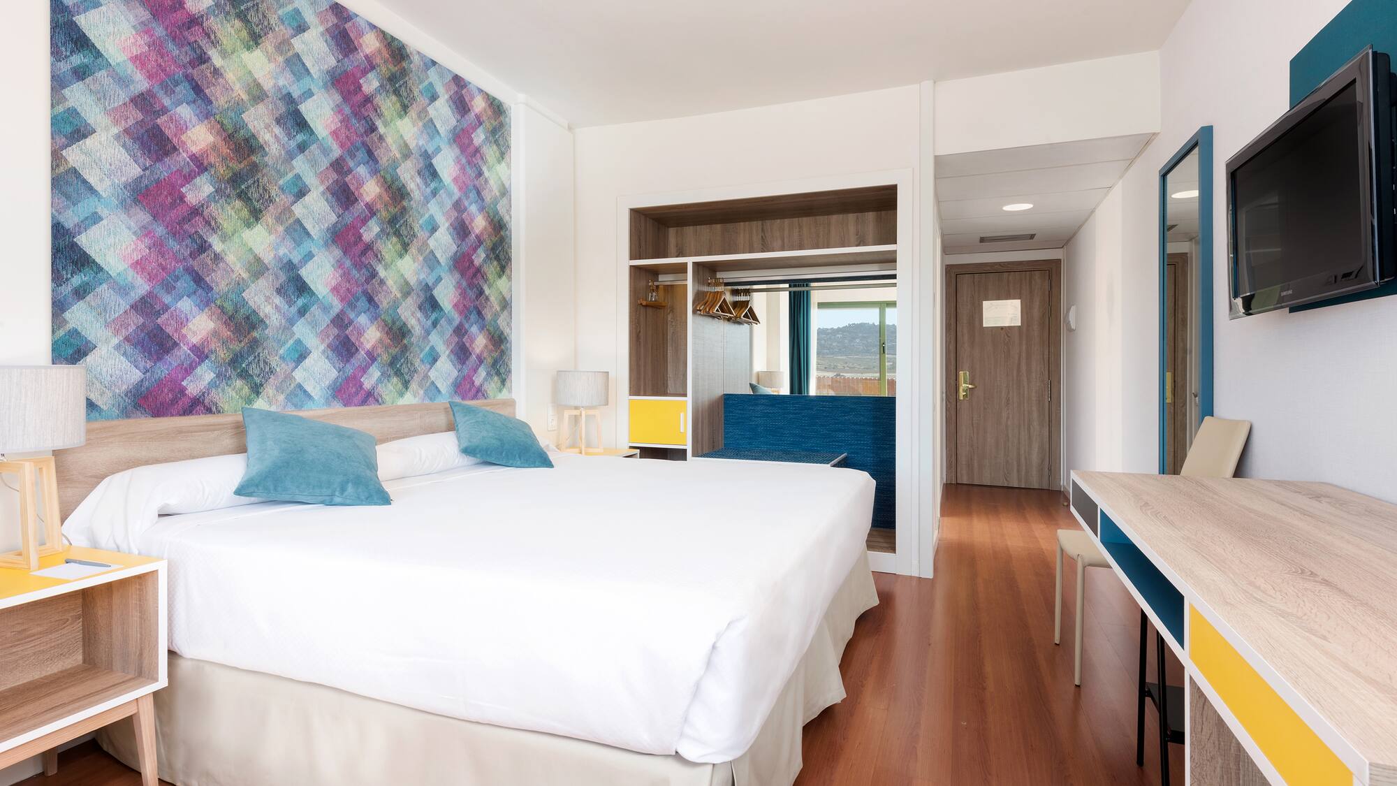 a room with a bed and a desk