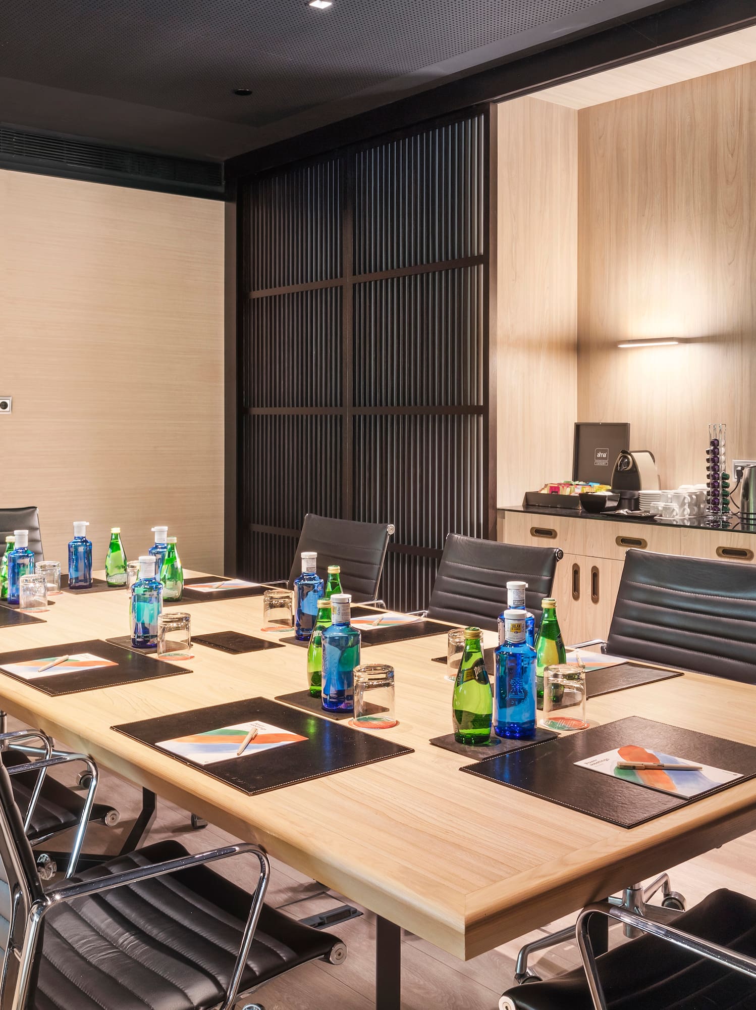 a conference room with a table and chairs