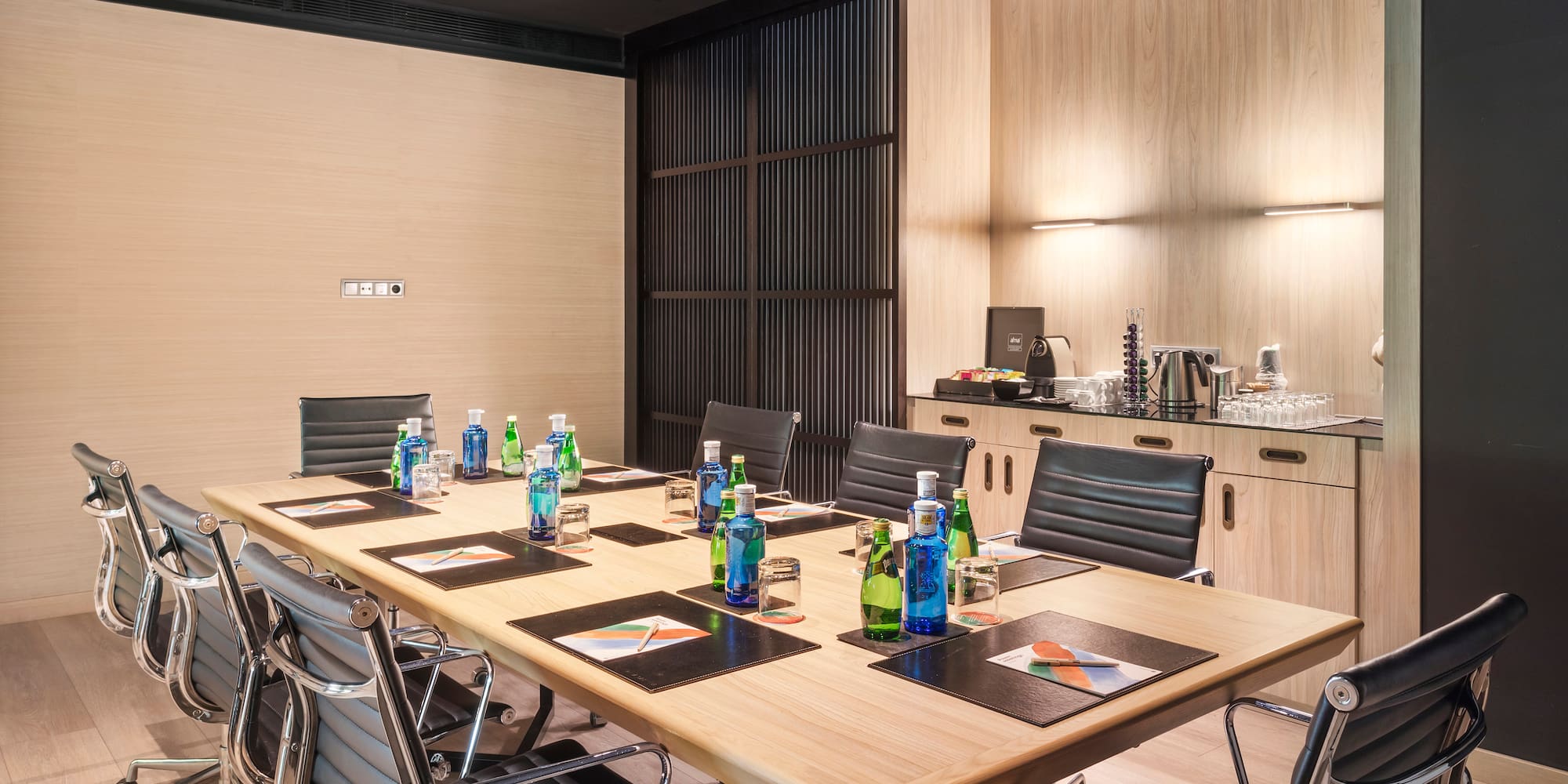 a conference room with a table and chairs