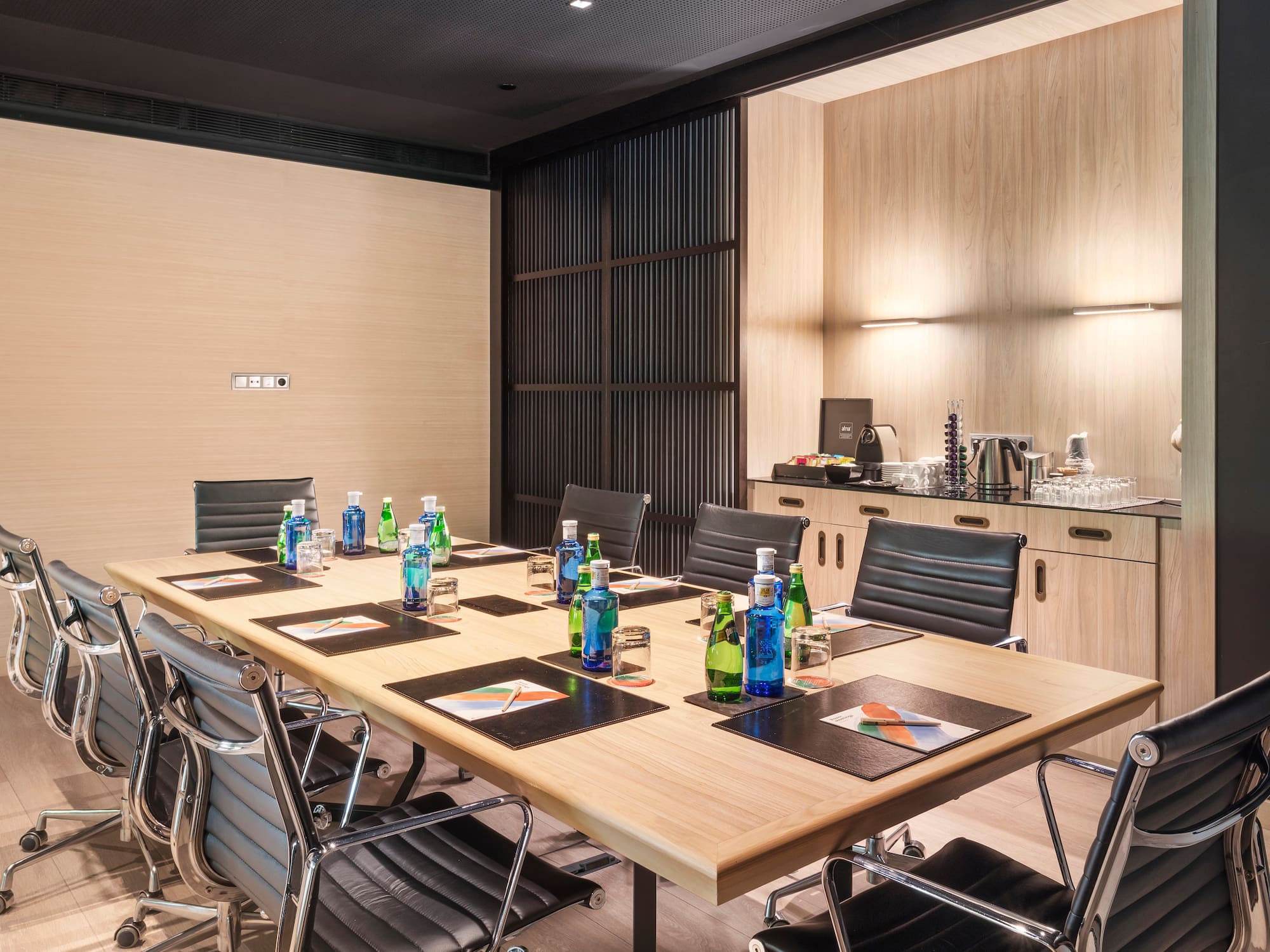a conference room with a table and chairs