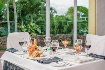 a table with plates of food and glasses on it