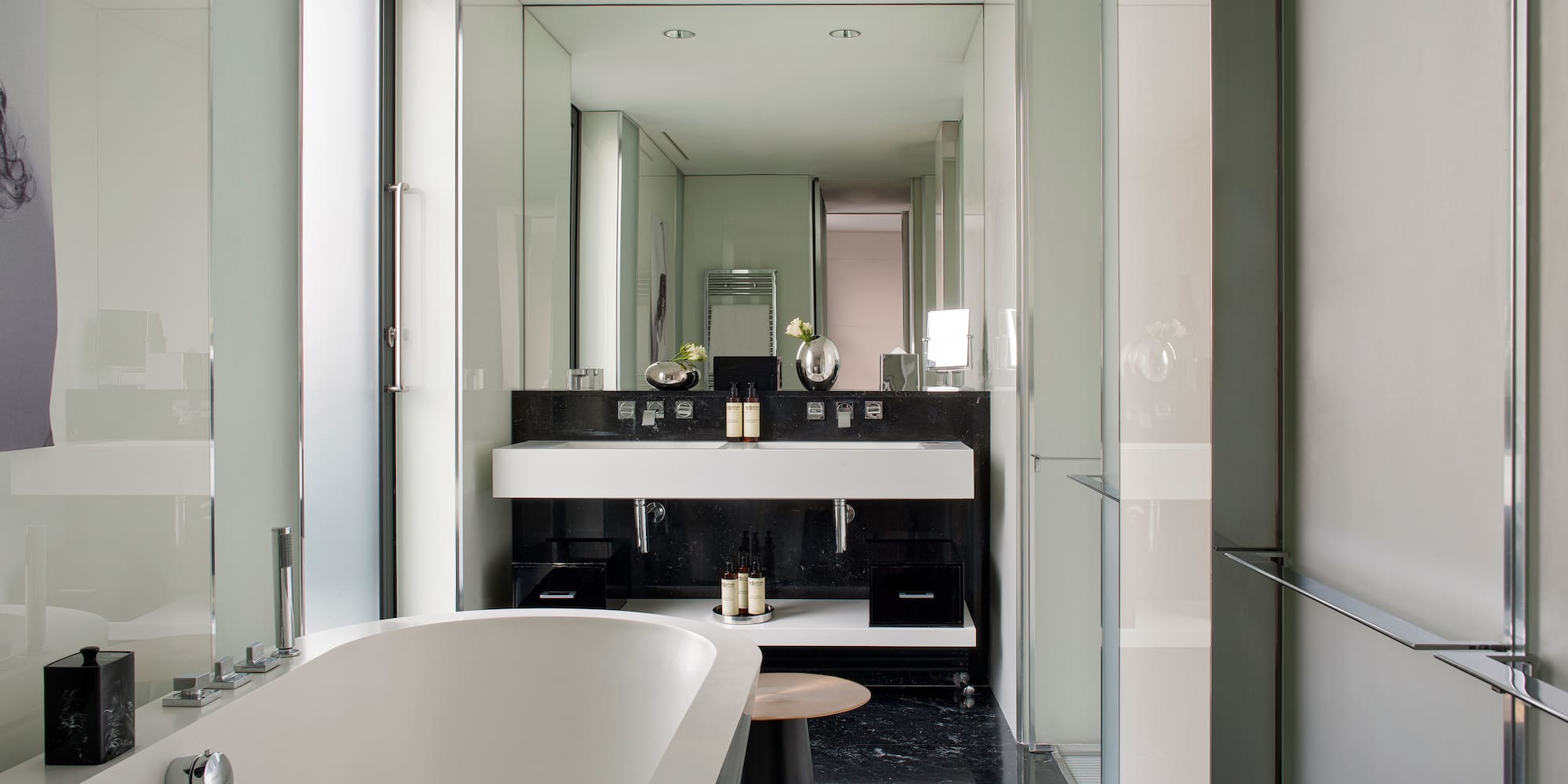 a bathroom with a tub and sink