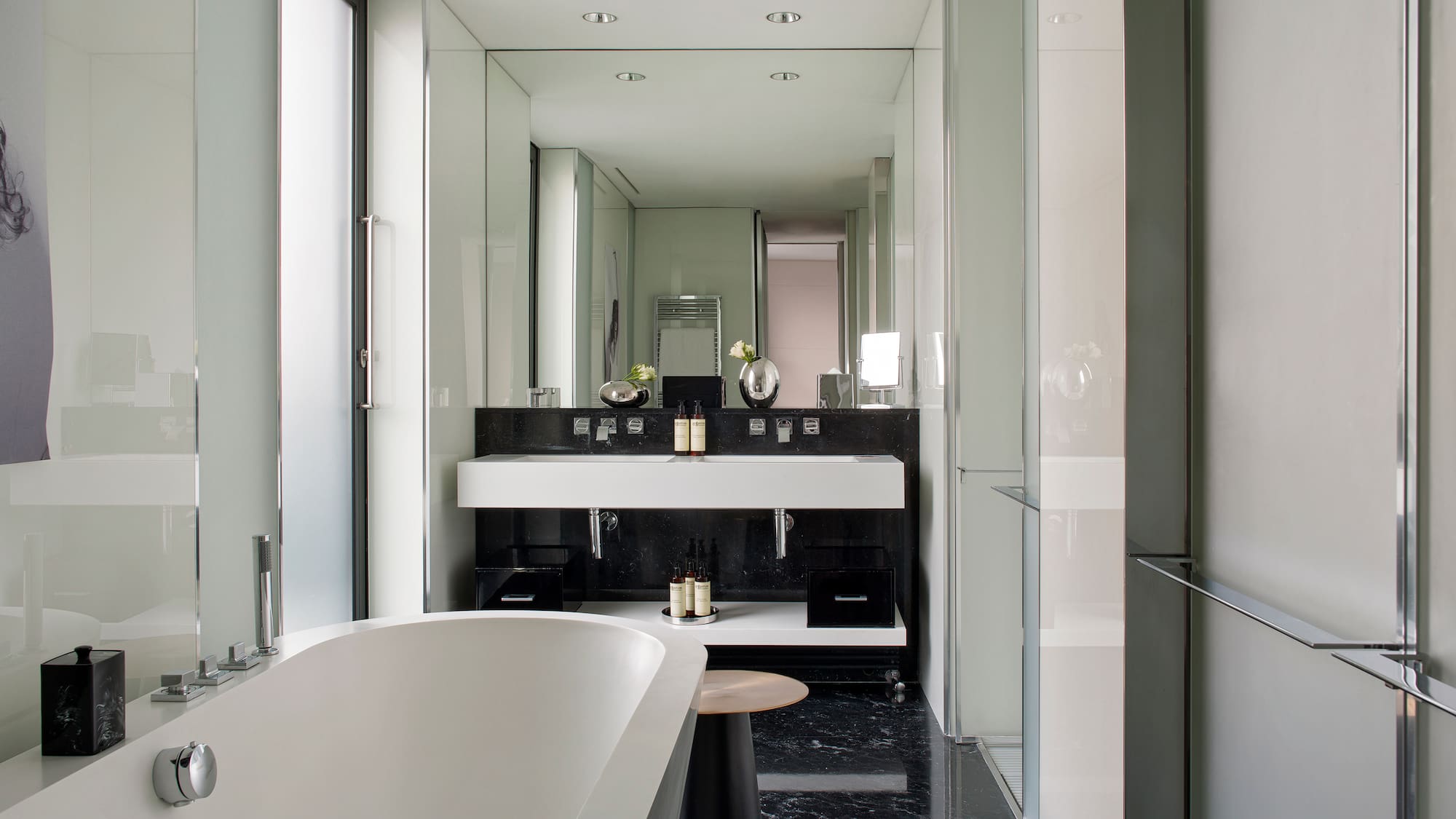 a bathroom with a tub and sink