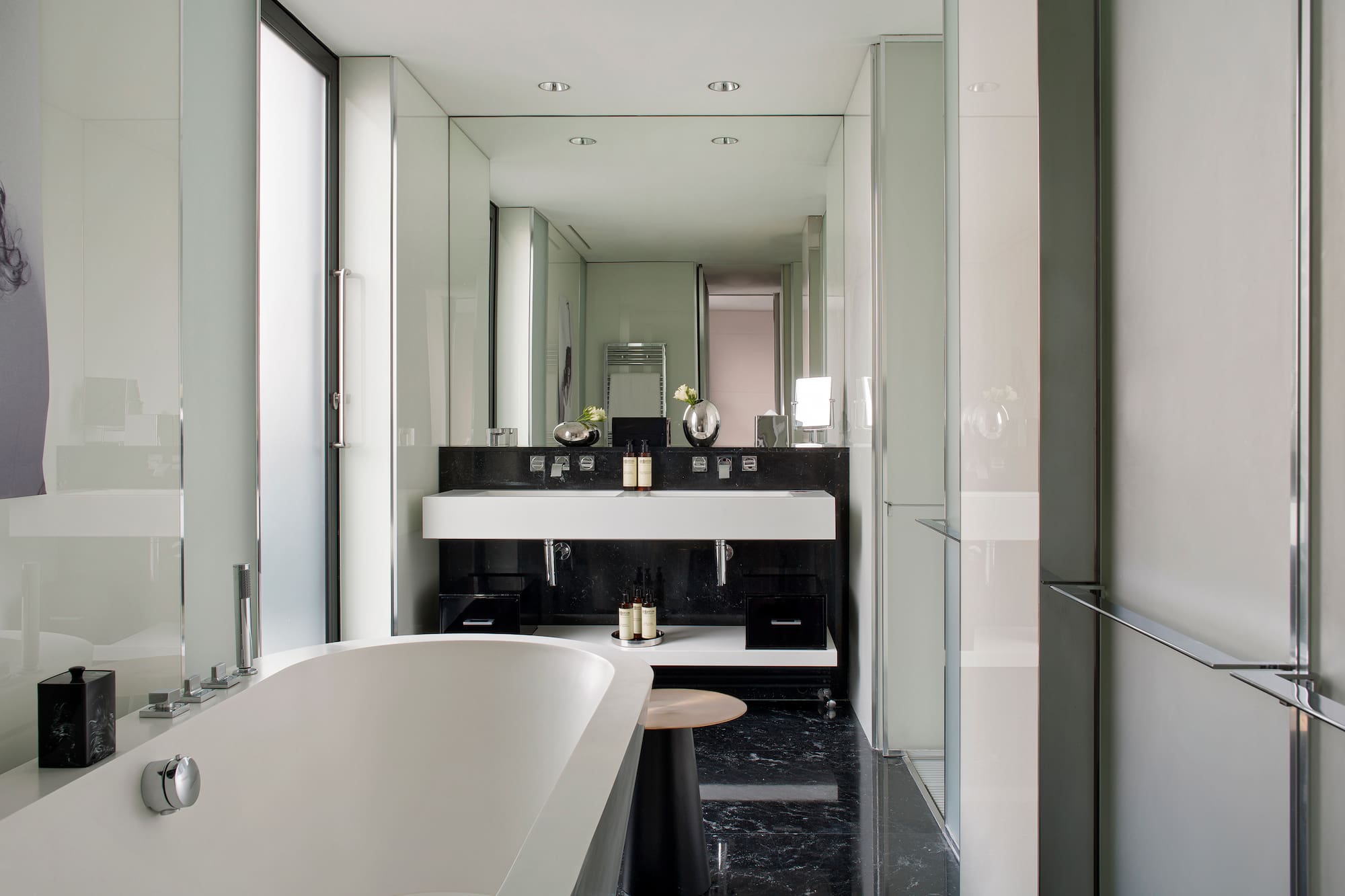 a bathroom with a tub and sink