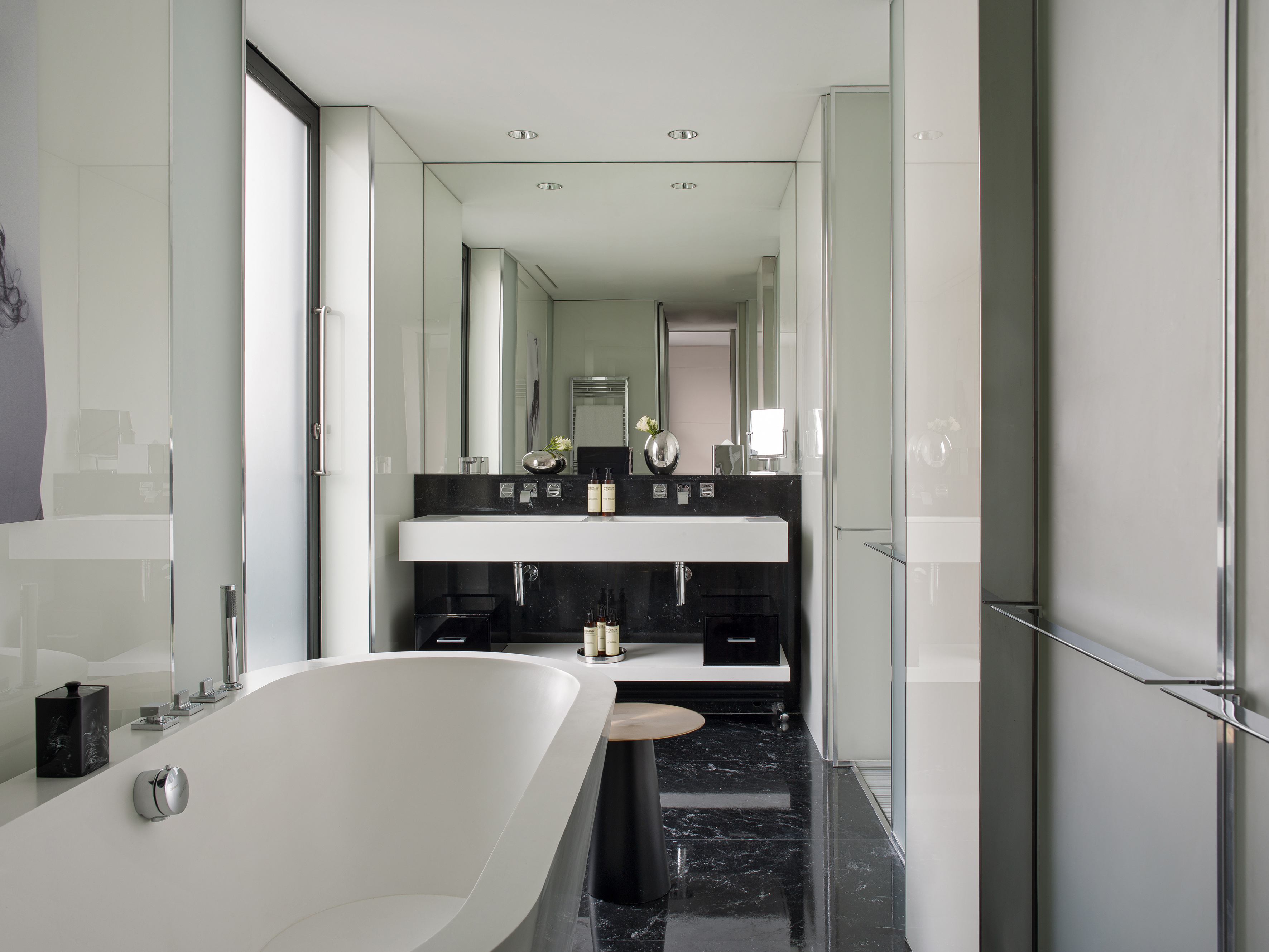 a bathroom with a tub and sink